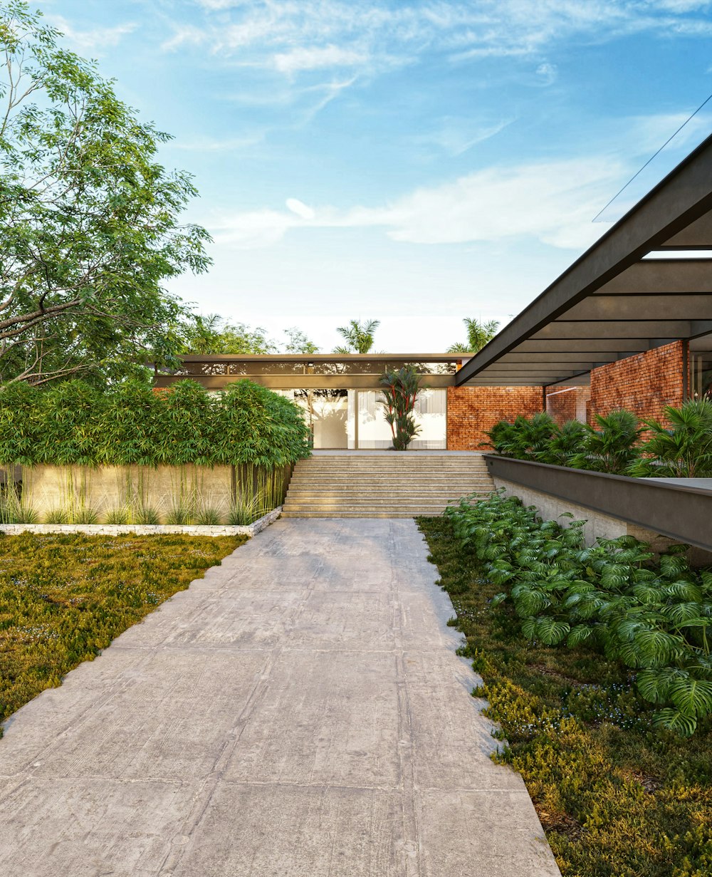 a walkway leading to a house with a green lawn