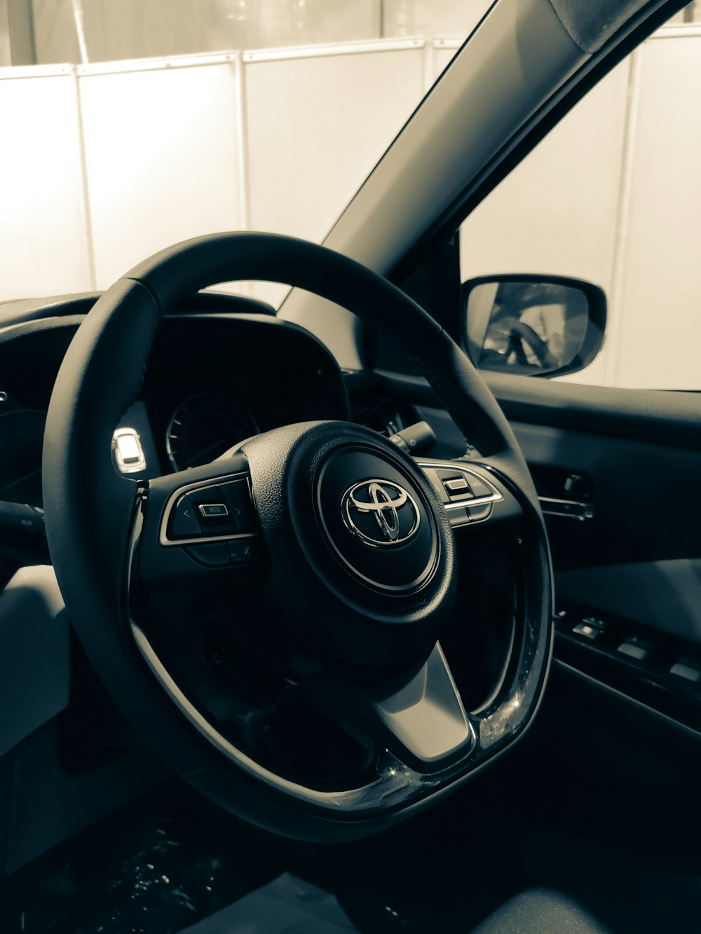 a black and white photo of a car dashboard