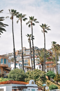 a white building with a clock on the front of it