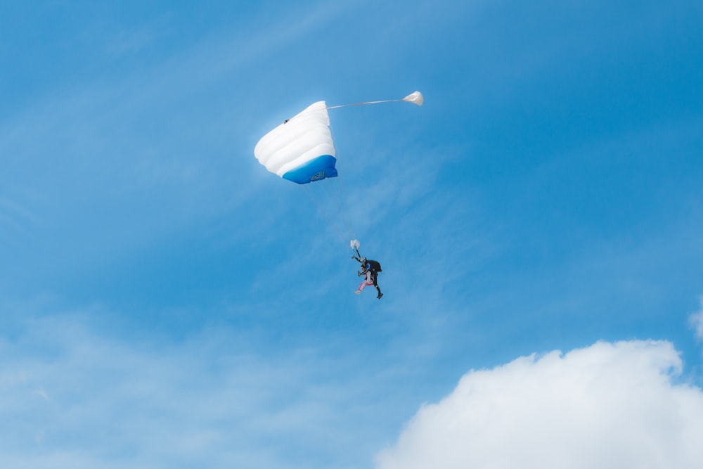 a man flying a kite high in the sky