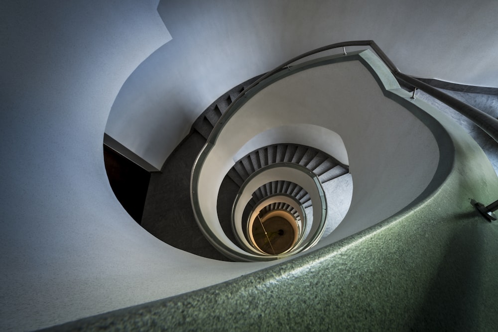 a view of a spiral staircase from the bottom