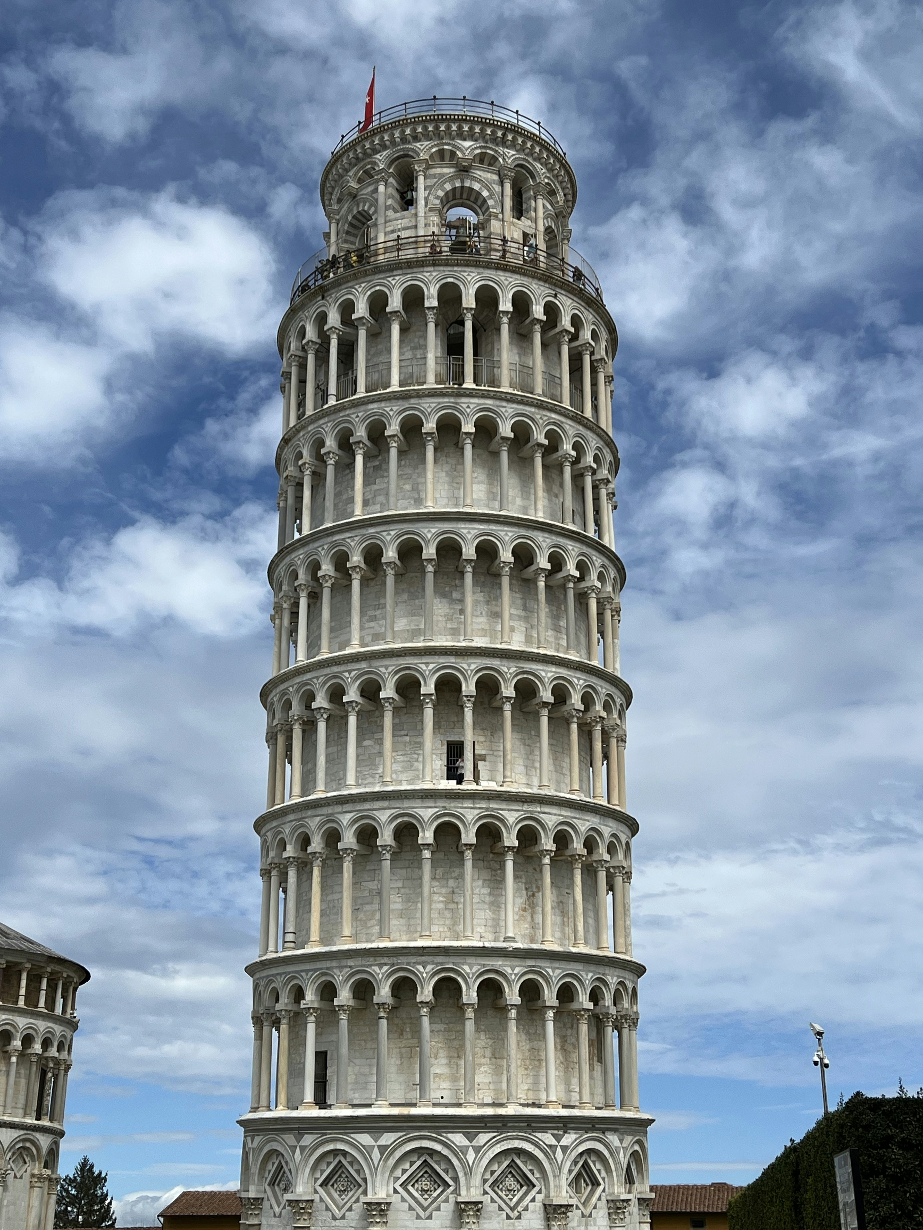 a very tall tower with a clock on it's side