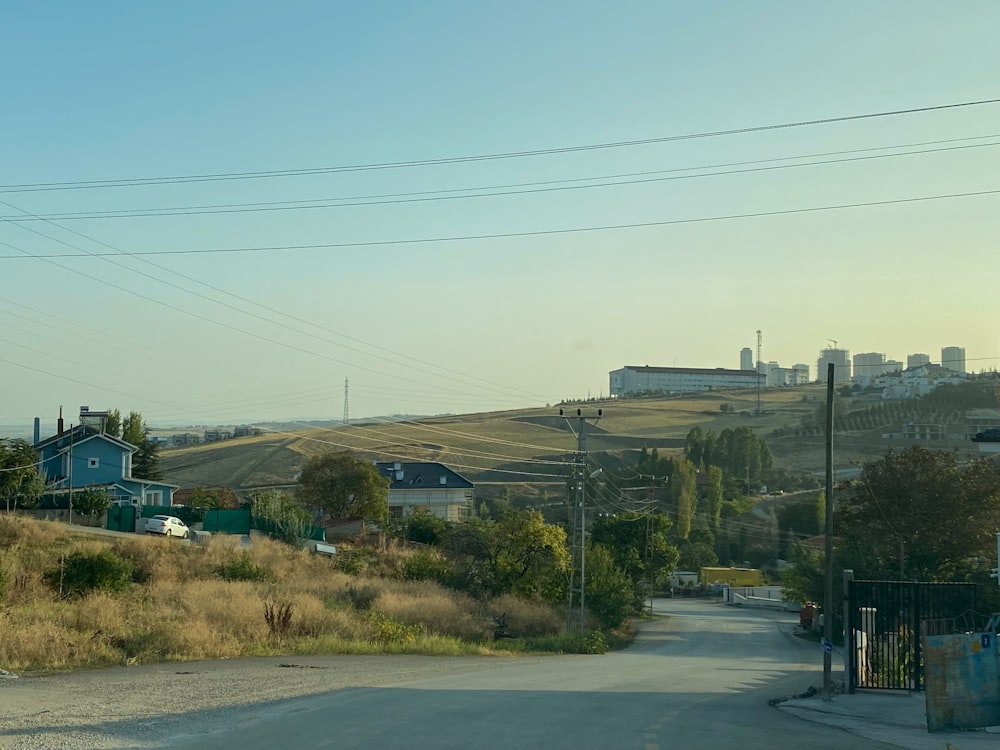 a rural road with power lines above it