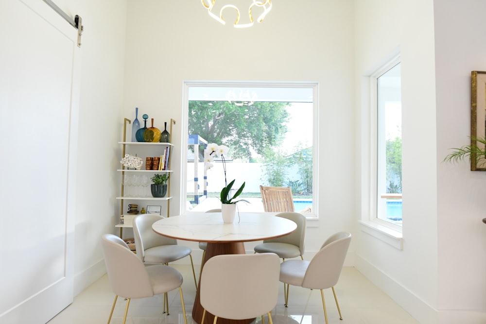 a dining room with a table and chairs