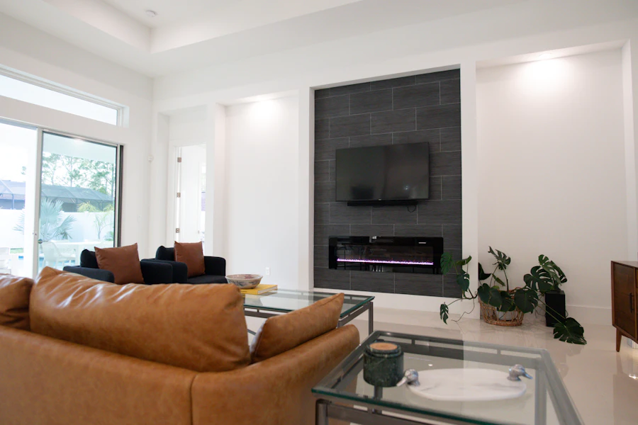 Stone-look TV wall with a built-in fireplace (inspiration)