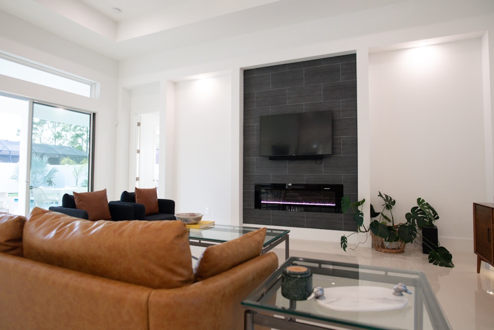 a living room filled with furniture and a flat screen tv