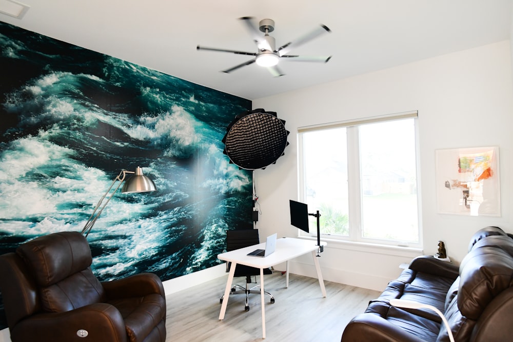 a living room with a large painting on the wall