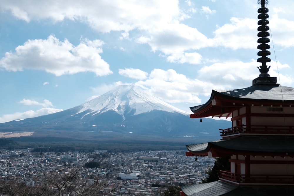 a view of a mountain with a pagoda in the foreground