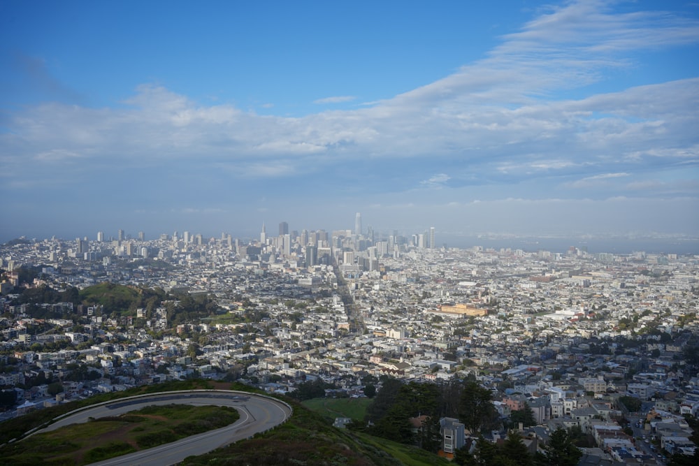 a view of a city from the top of a hill