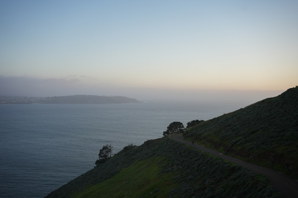 a view of the ocean from a hill