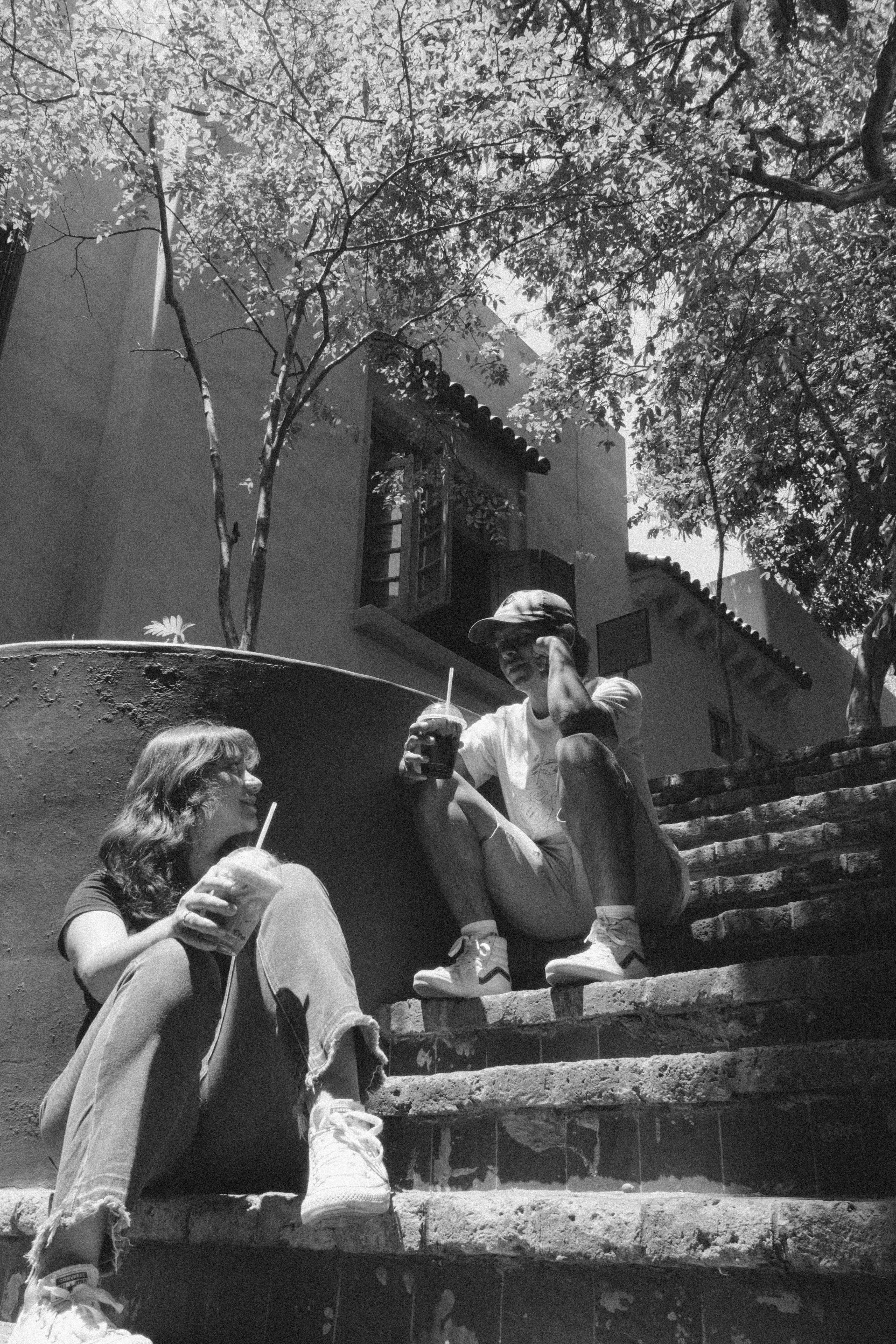 a couple of people sitting on some steps