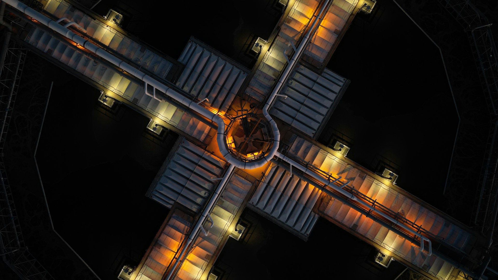 an aerial view of a train station at night