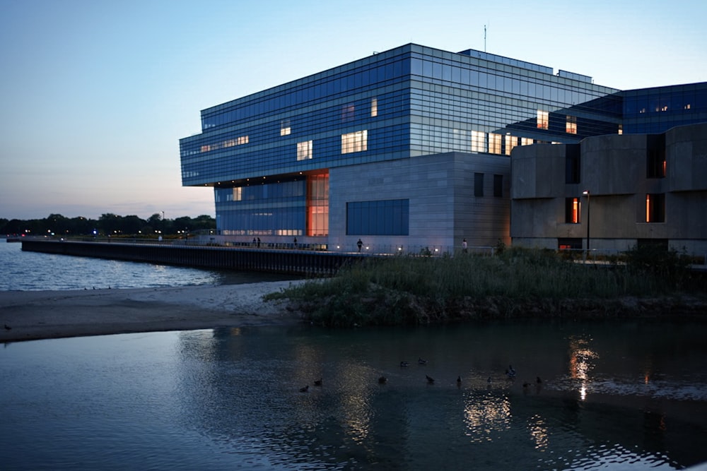 a large building sitting next to a body of water