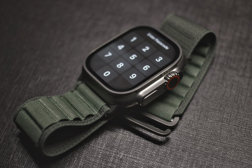 an apple watch with a green strap
