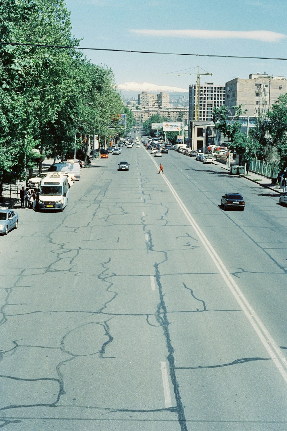 a street with cars parked on both sides of it