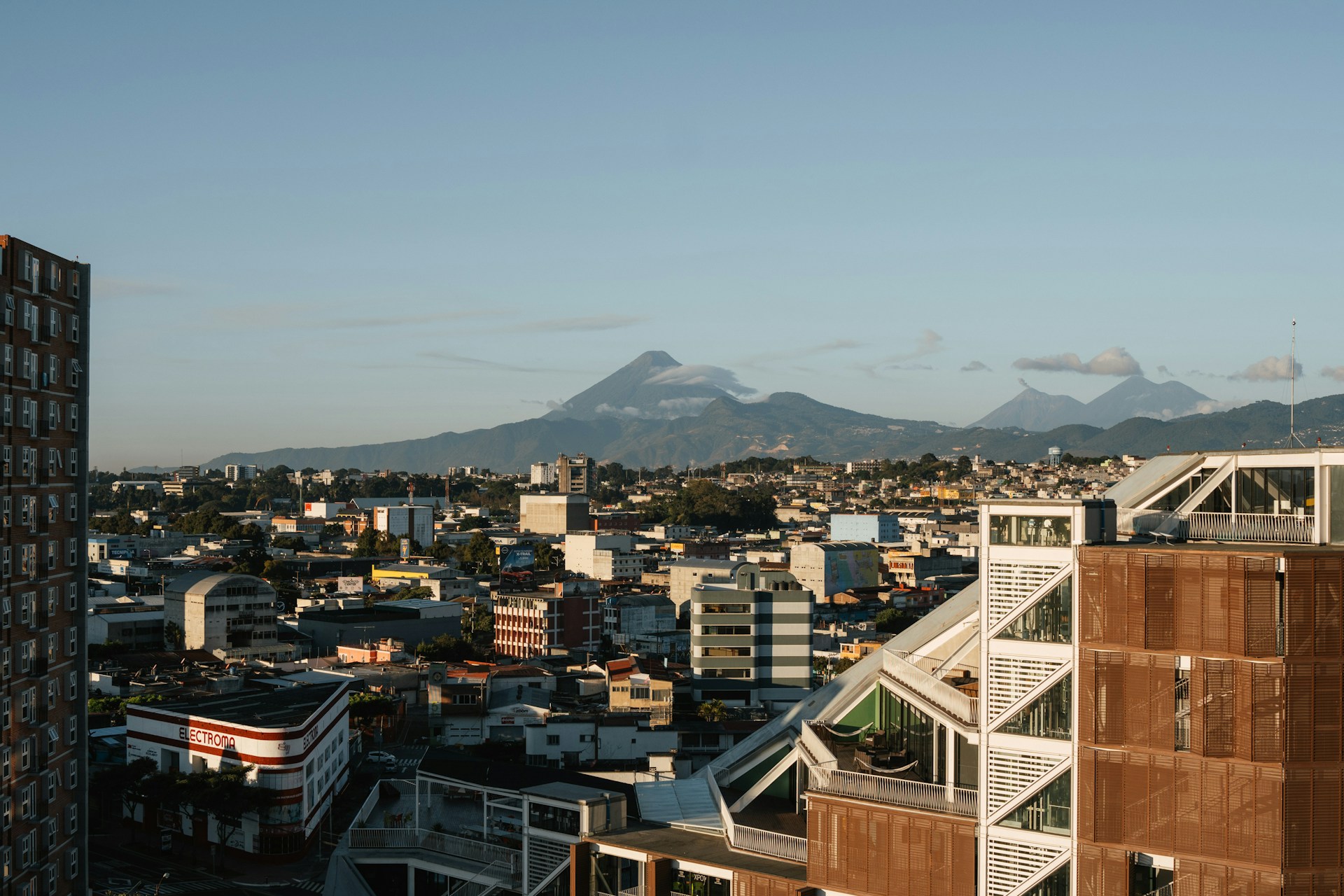 a view of a city with mountains in the background