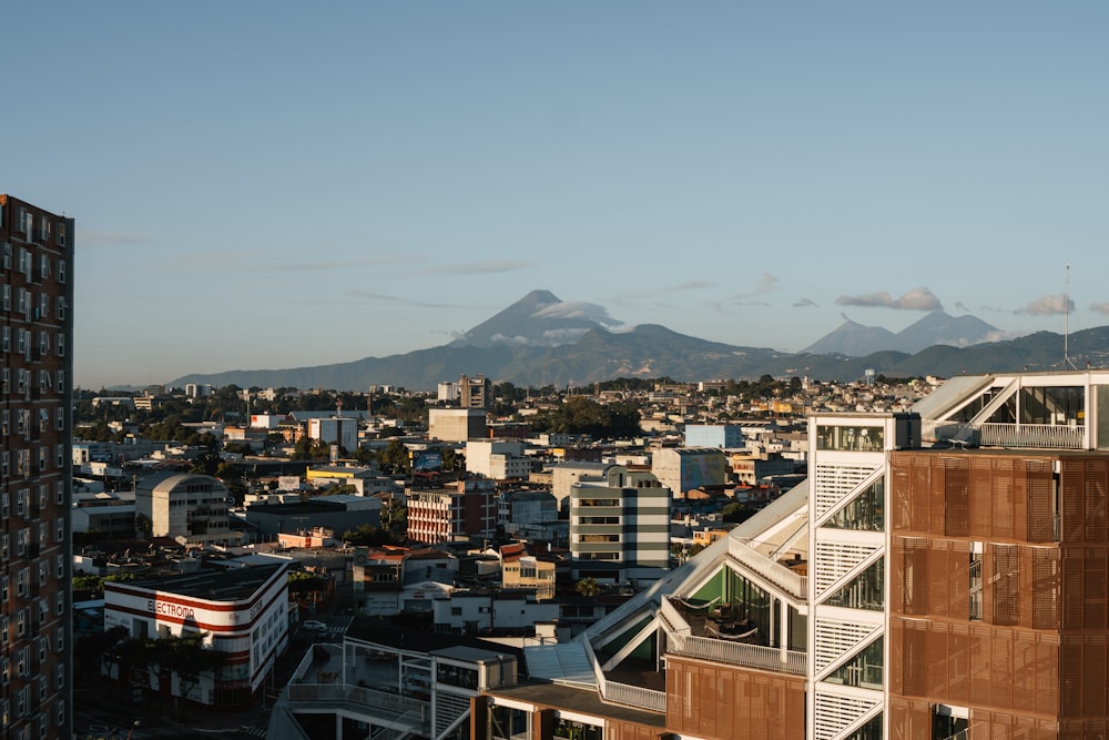 a view of a city with mountains in the background