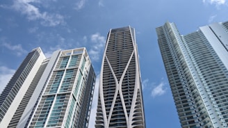 a couple of tall buildings sitting next to each other