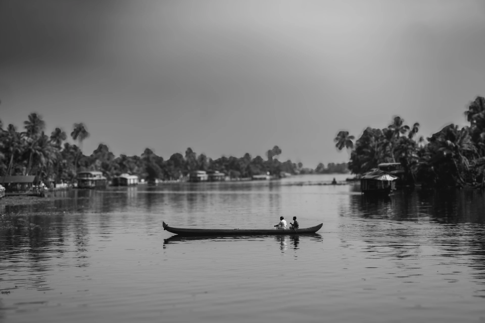 two people in a canoe on a river