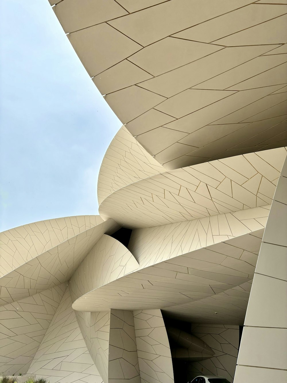 a large white building with a sky in the background