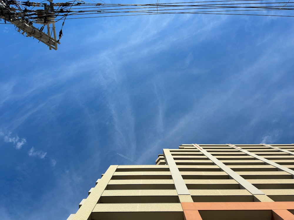 a tall building with a sky in the background