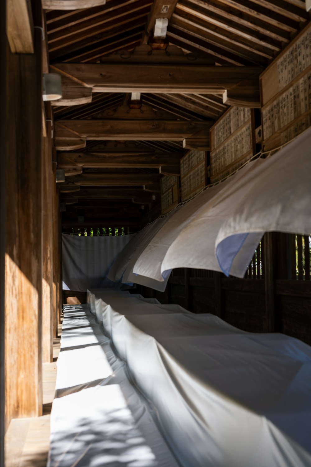 a row of beds covered in white sheets