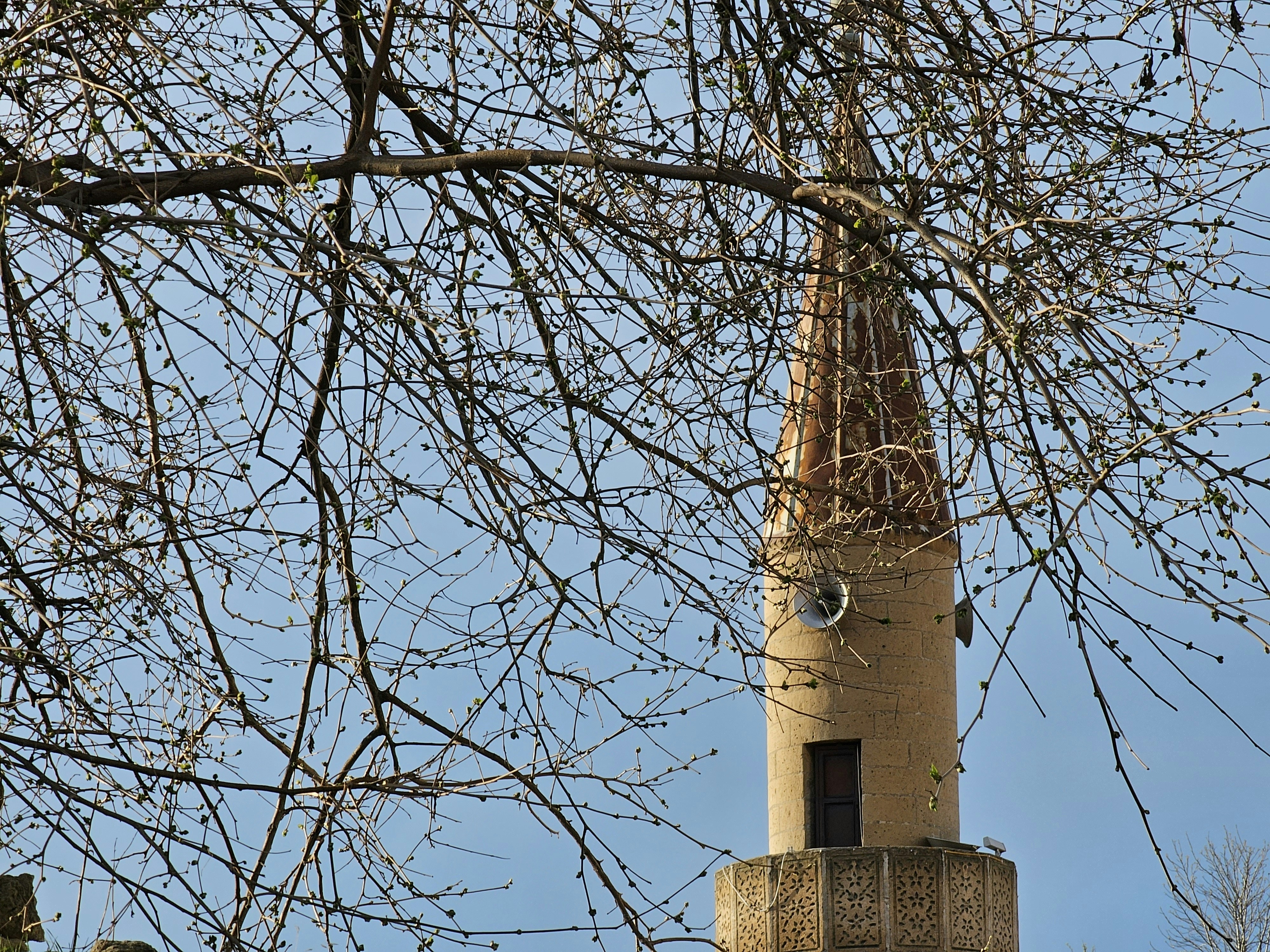 a tall tower with a clock on the top of it