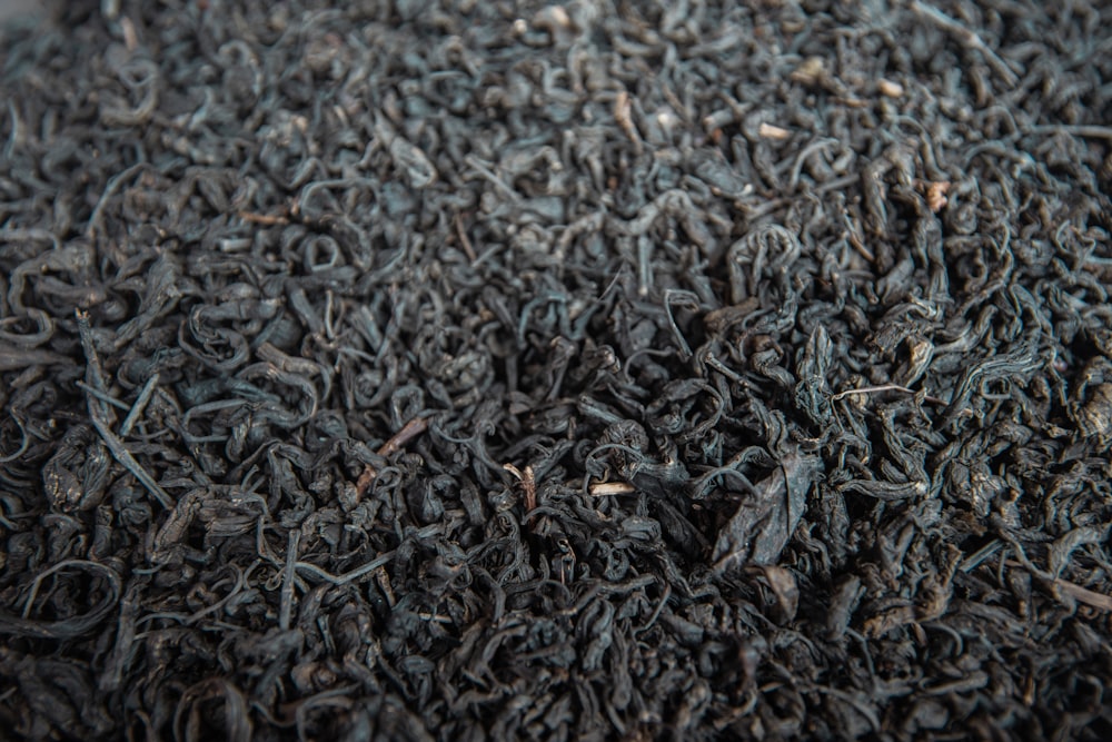 a close up of a pile of black tea