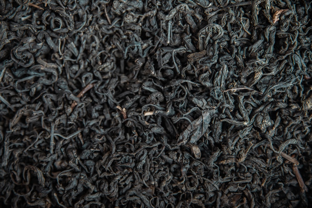 a pile of black tea is shown close up