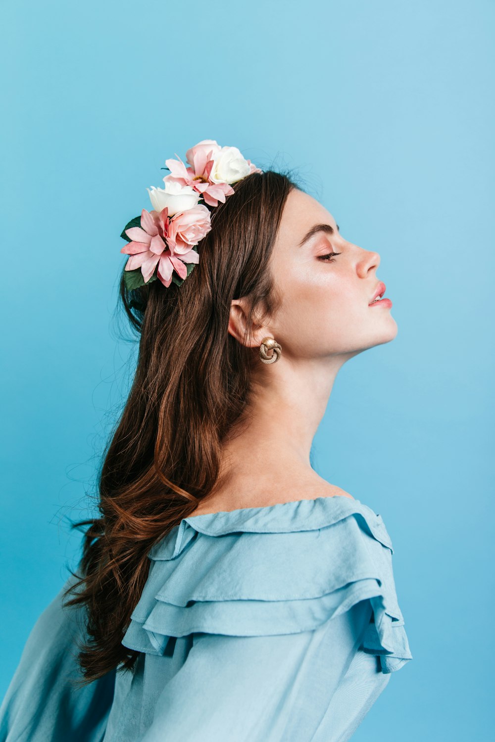 a woman with a flower in her hair