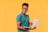 a man in glasses holding a laptop computer