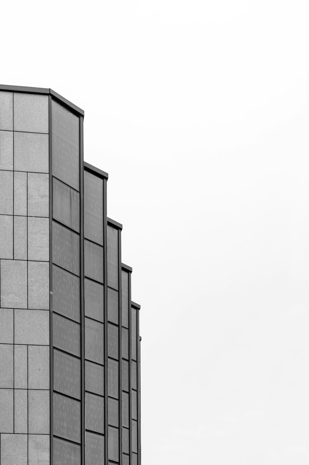 a black and white photo of a tall building