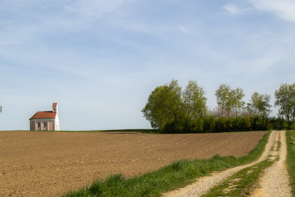 a house in the middle of a field