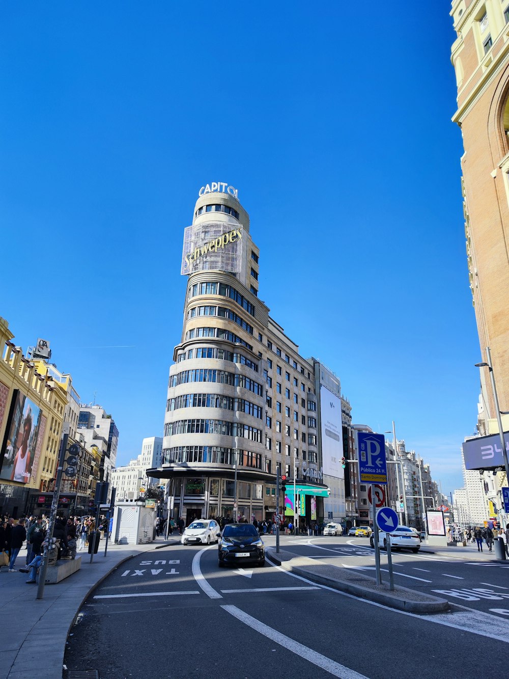 a very tall building sitting on the side of a road