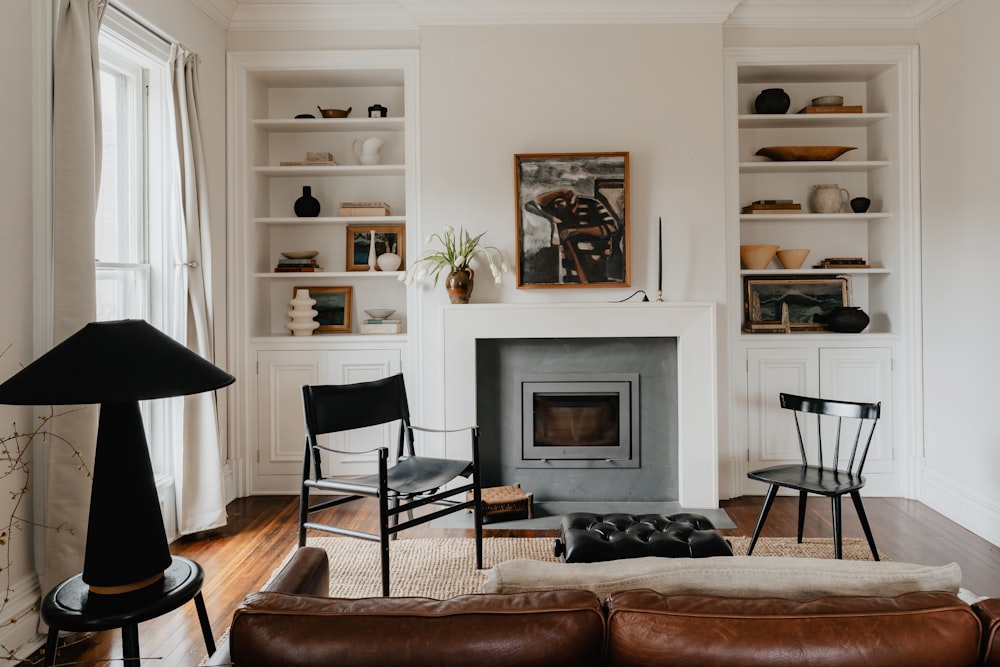 a living room filled with furniture and a fire place