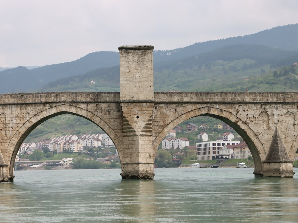 a stone bridge over a body of water