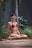 a woman in a red bikini sitting in a yoga position