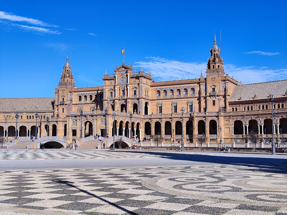 a large building with a checkered floor in front of it