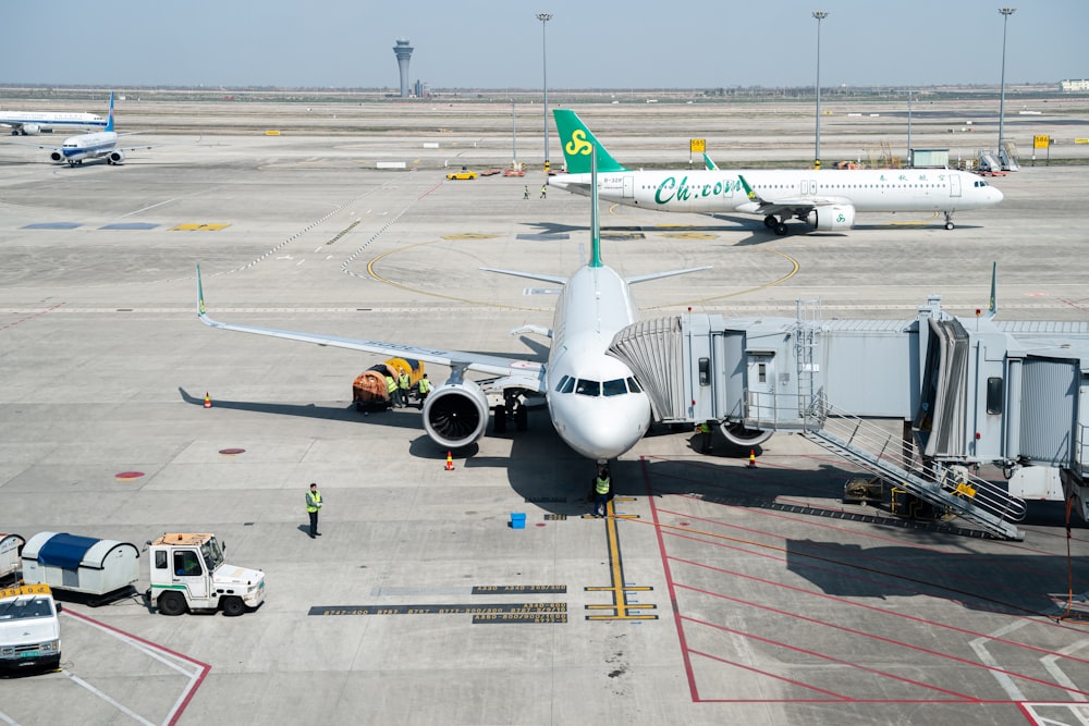 a large jetliner sitting on top of an airport tarmac