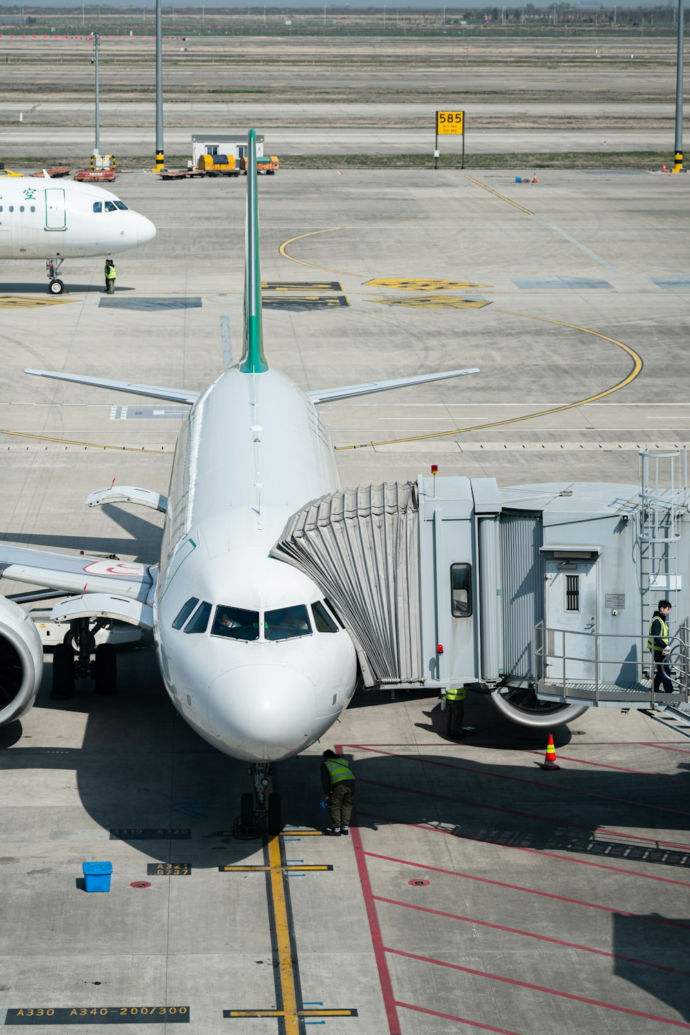 a large jetliner sitting on top of an airport tarmac