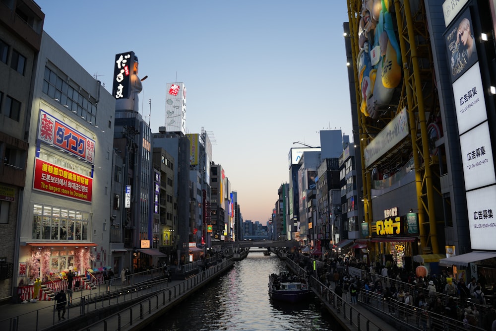 a river running through a city next to tall buildings