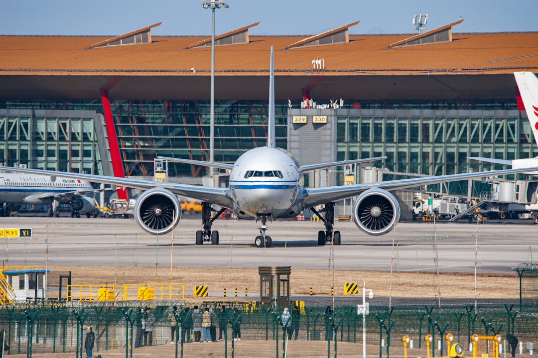 a large jetliner sitting on top of an airport tarmac,
