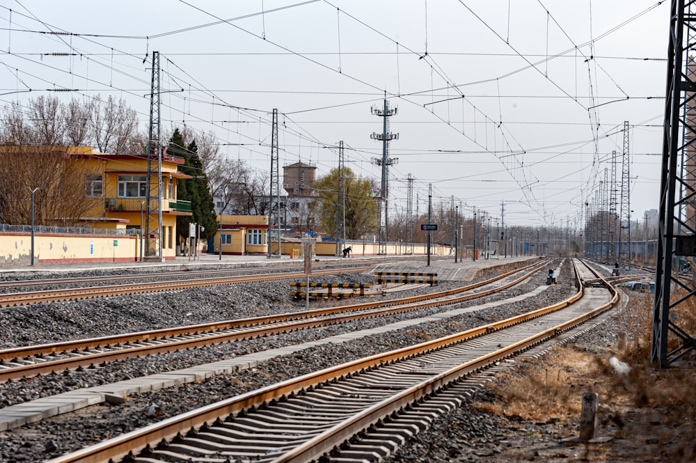 a train track with a building in the background