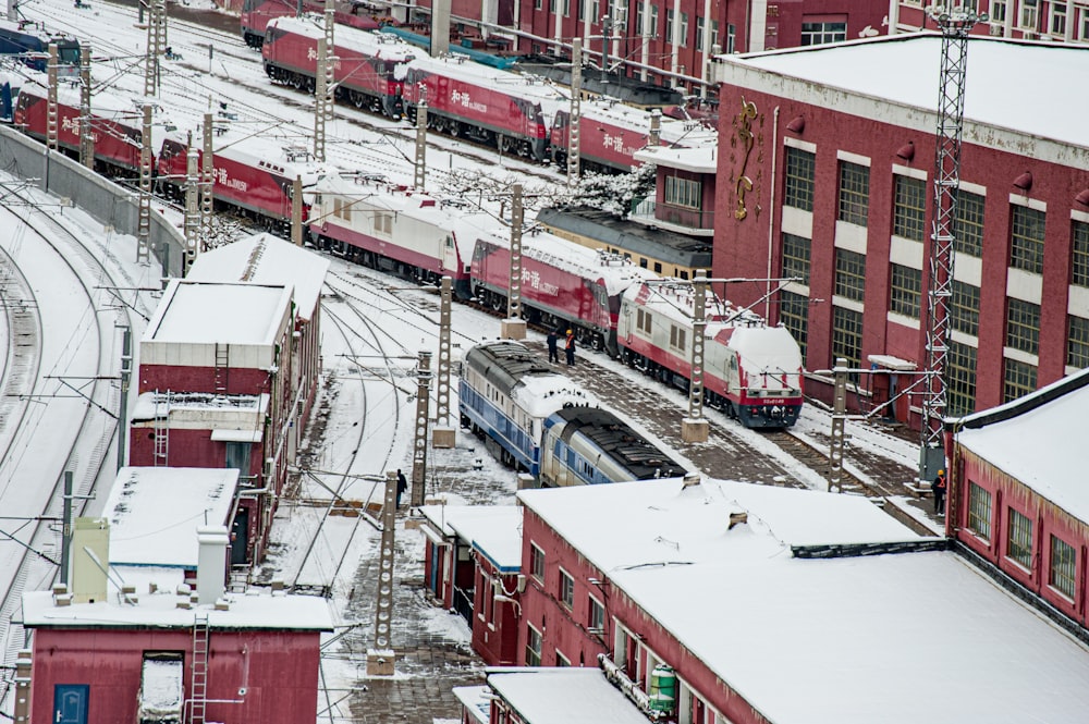 a train traveling through a snow covered city
