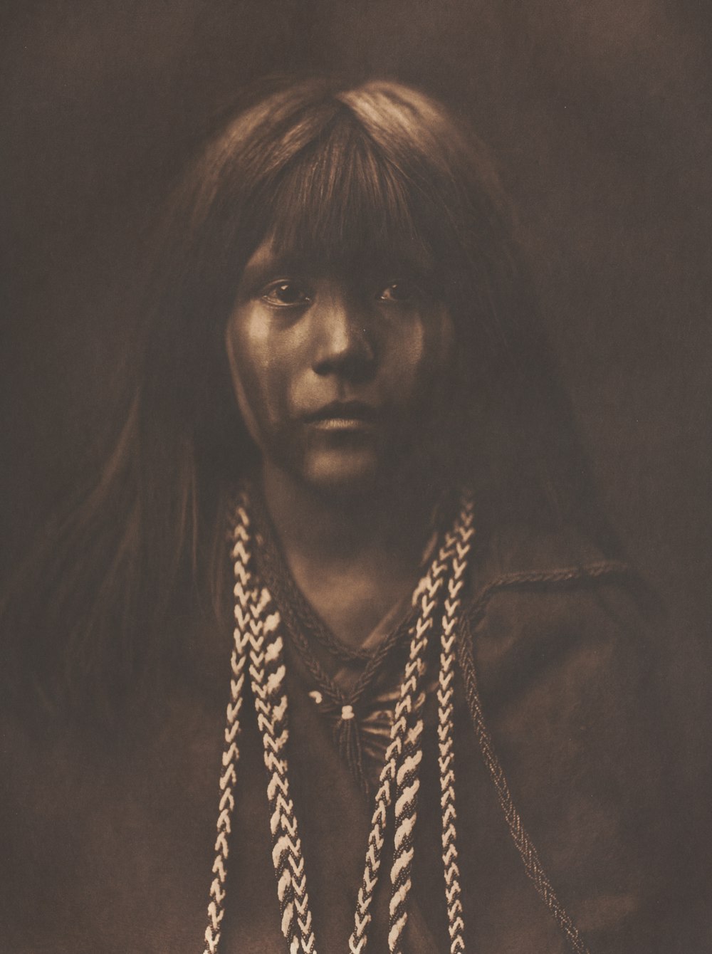 an old photo of a native american woman