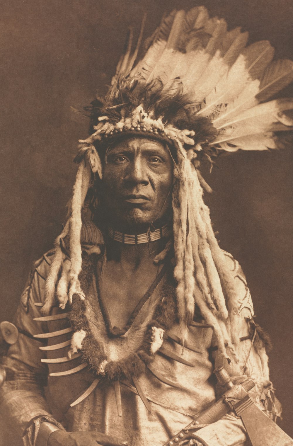 an old photo of a native american man