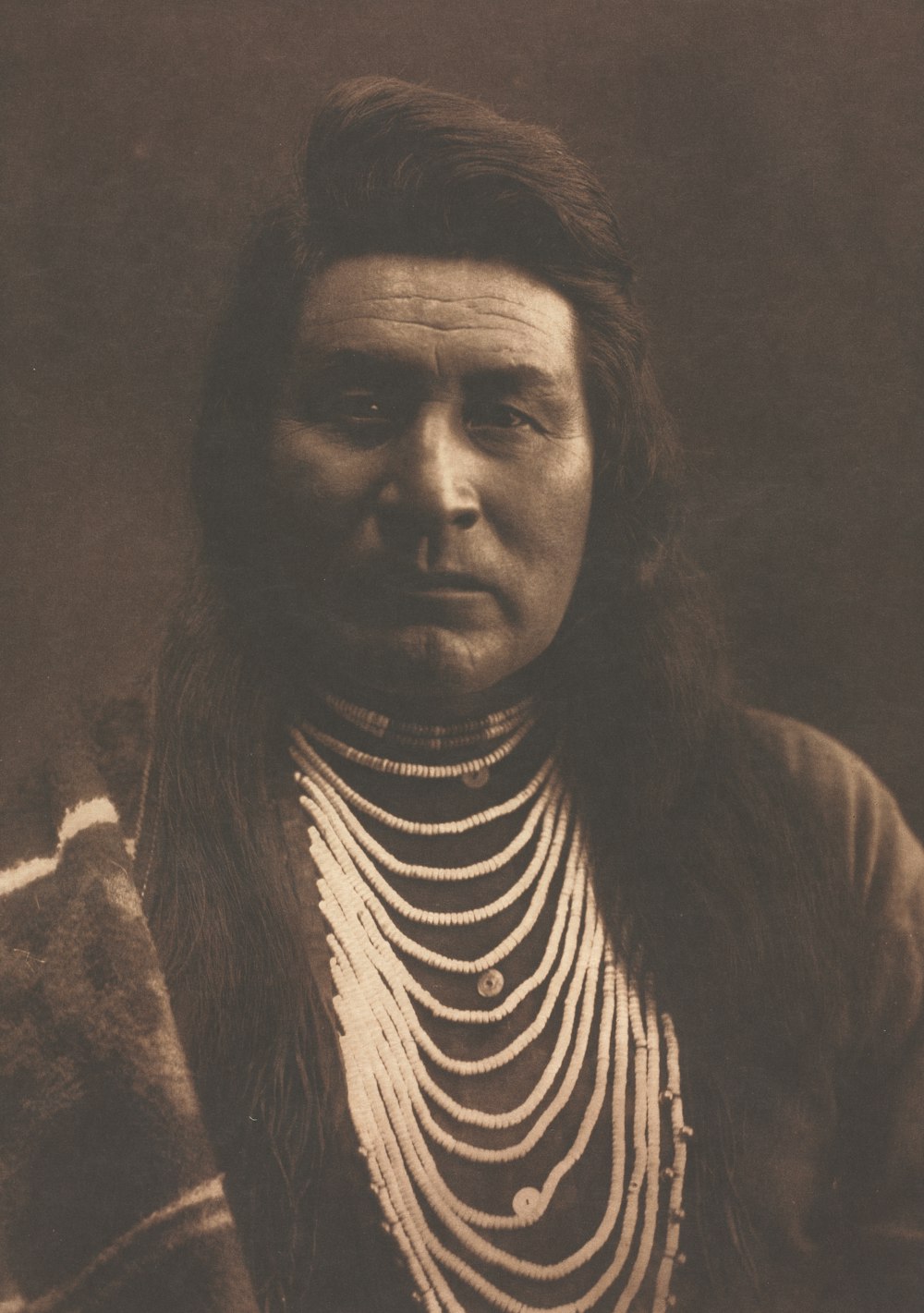 an old photo of a native american woman
