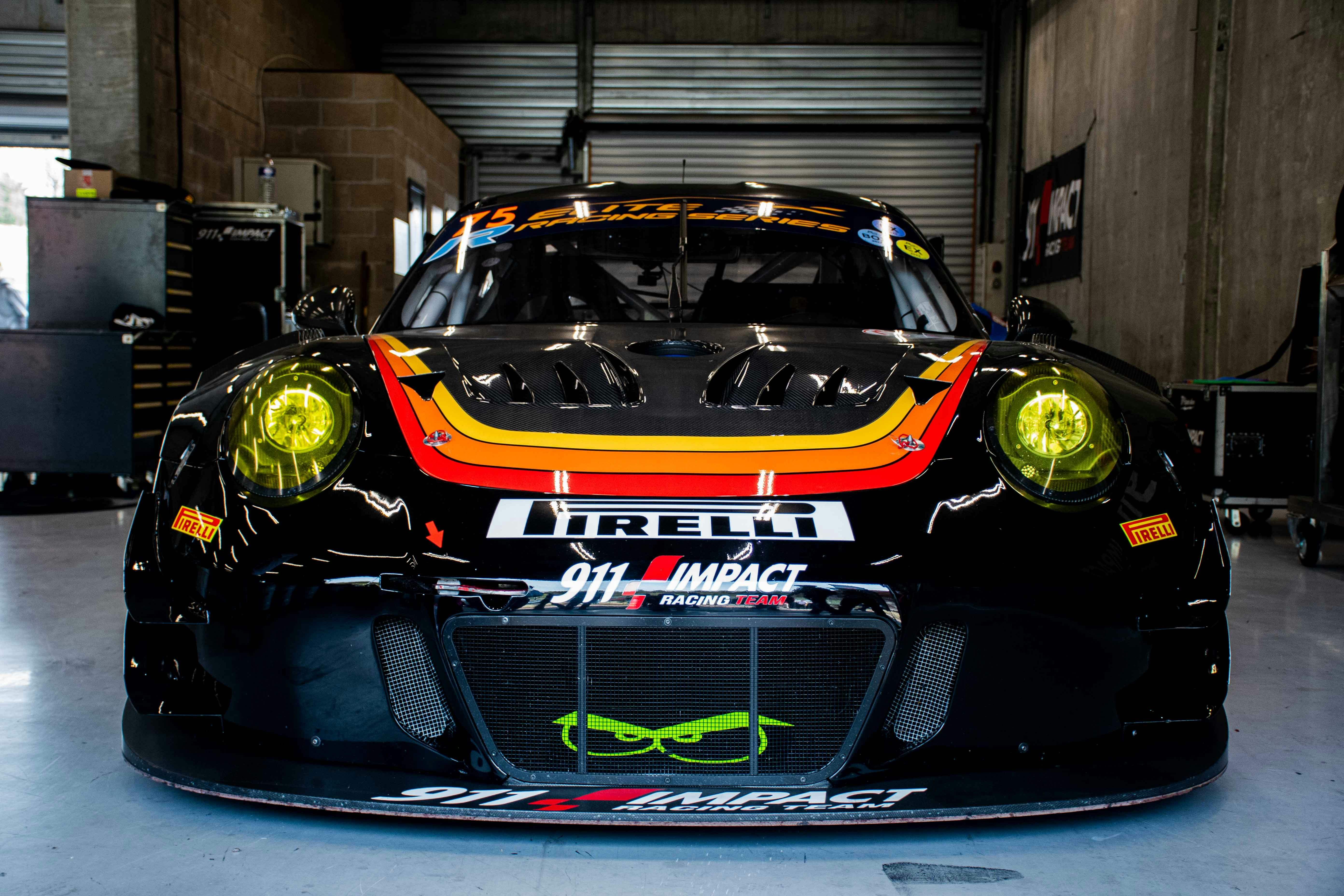 a black sports car parked in a garage