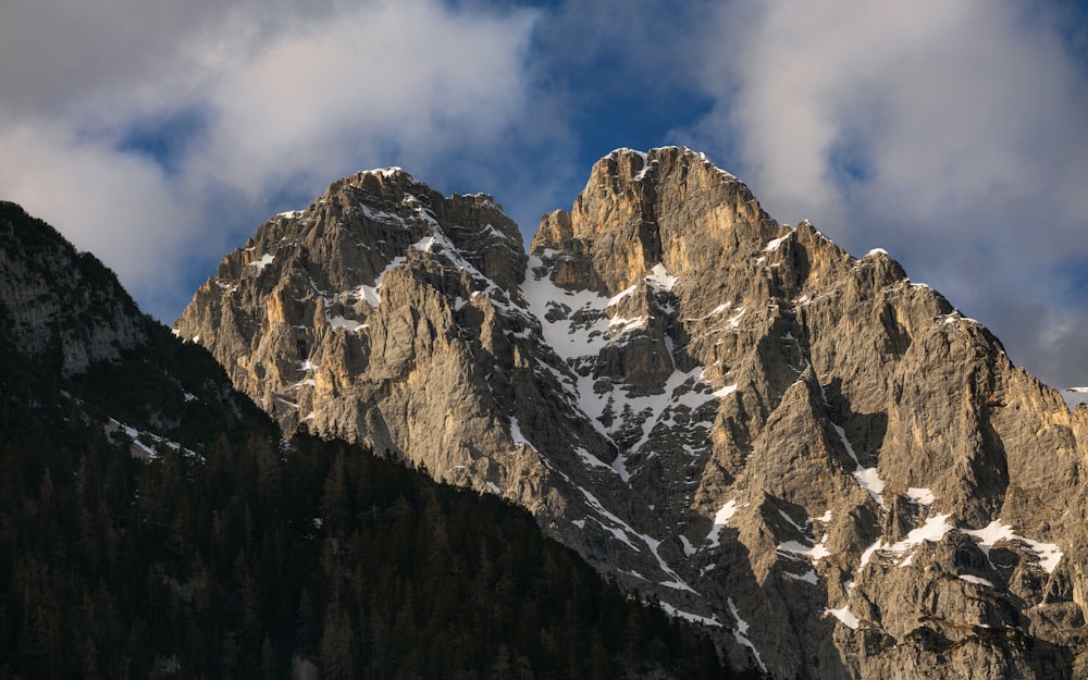 a mountain range with snow on the top of it