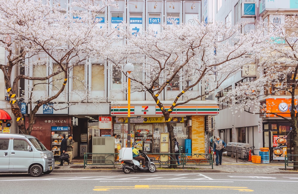 a white van is parked in front of a store